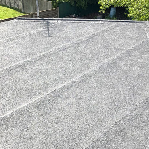 flat roof on house roof being repaired