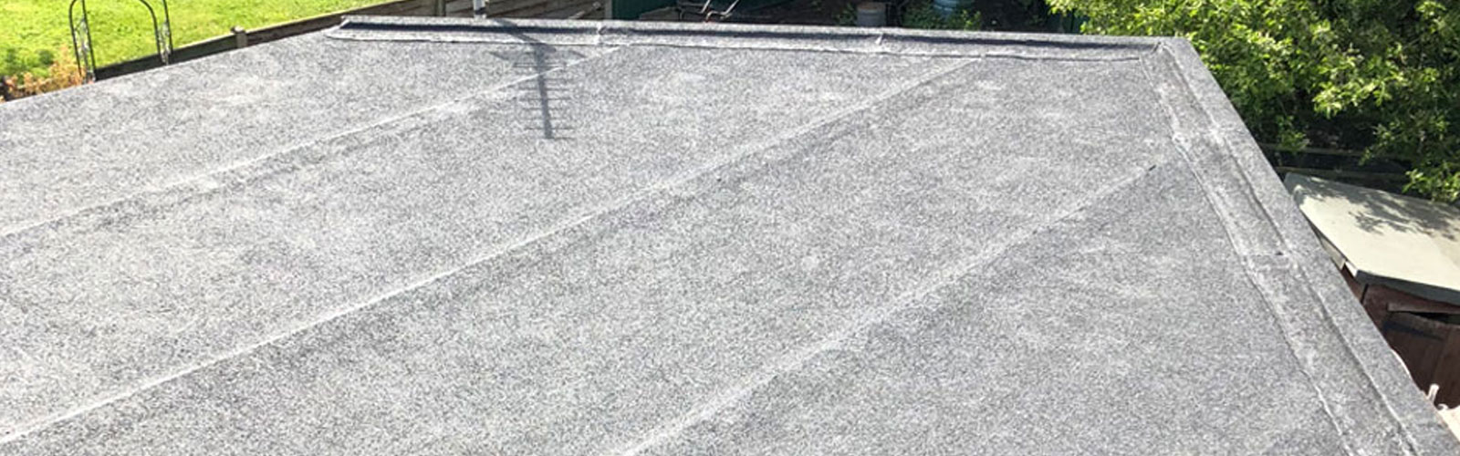 flat roof on house roof being repaired
