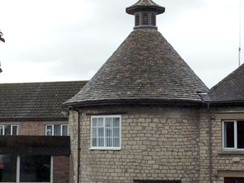Rounded peak roof with pigeon tower
